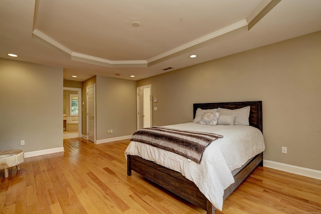 8 Dogwood Ct, Woodbridge, CT 06525 - bedroom featuring a raised ceiling, ornamental molding, light wood-style flooring, recessed lighting, and ensuite bath