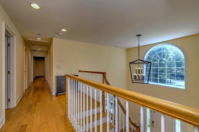 8 Dogwood Ct, Woodbridge, CT 06525 - corridor with attic access, an upstairs landing, recessed lighting, light wood-style floors, and a chandelier