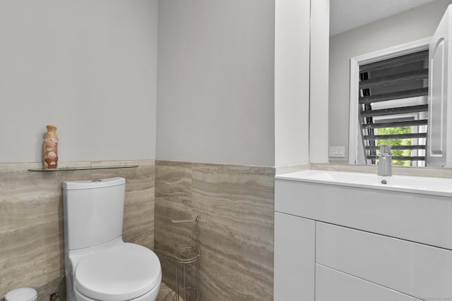 3 Radio Pl Unit 3, Stamford, CT 06906 - bathroom featuring tile walls, vanity, and a wainscoted wall