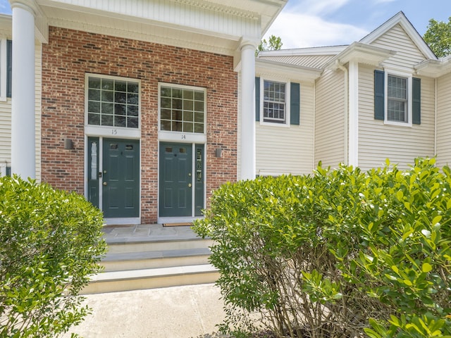 570 Danbury Rd Unit 14, Ridgefield, CT 06877 - view of exterior entry featuring brick siding