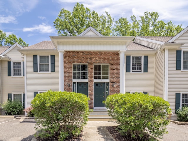 570 Danbury Rd Unit 14, Ridgefield, CT 06877 - view of front of property with brick siding, uncovered parking, and roof with shingles