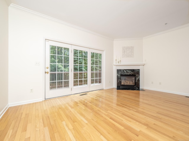 570 Danbury Rd Unit 14, Ridgefield, CT 06877 - unfurnished living room with crown molding, light wood finished floors, and a premium fireplace