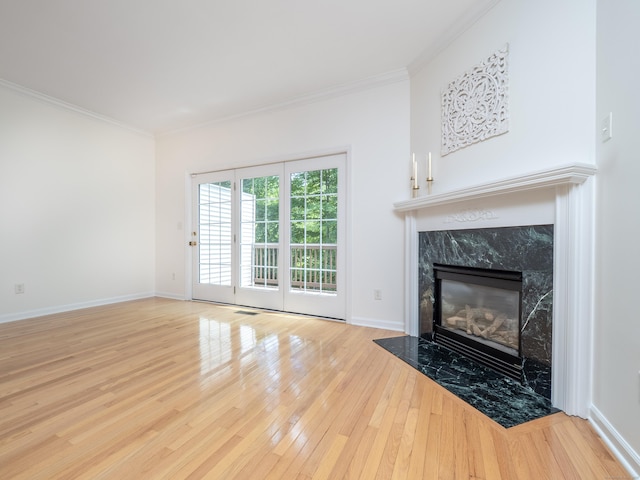 570 Danbury Rd Unit 14, Ridgefield, CT 06877 - unfurnished living room with hardwood / wood-style flooring, a fireplace, and crown molding