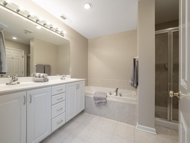 570 Danbury Rd Unit 14, Ridgefield, CT 06877 - bathroom with double vanity, a garden tub, a shower stall, and tile patterned flooring