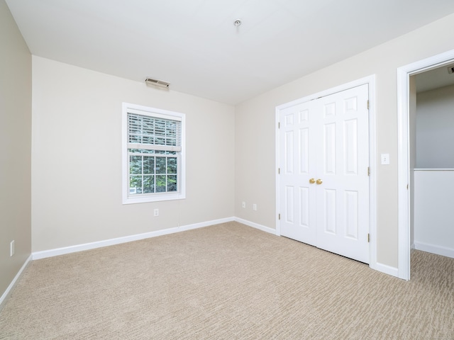 570 Danbury Rd Unit 14, Ridgefield, CT 06877 - unfurnished bedroom featuring carpet floors and a closet