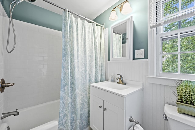 29 Boswell Rd, West Hartford, CT 06107 - full bath featuring plenty of natural light, shower / tub combo with curtain, vanity, and wainscoting