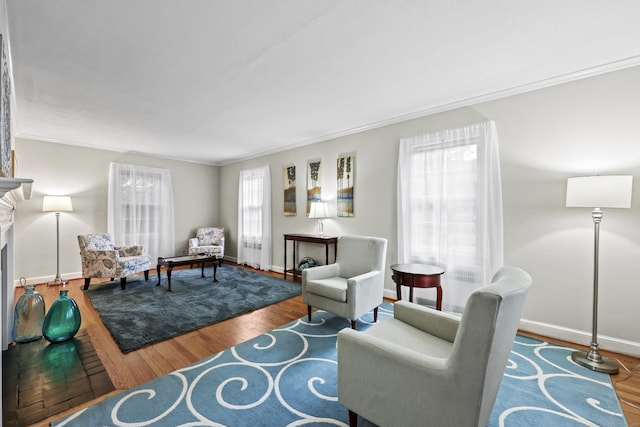 29 Boswell Rd, West Hartford, CT 06107 - living room with wood finished floors, crown molding, and a fireplace
