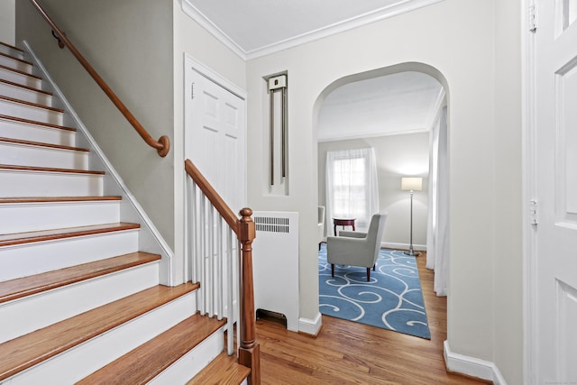 29 Boswell Rd, West Hartford, CT 06107 - staircase with arched walkways, ornamental molding, and wood finished floors