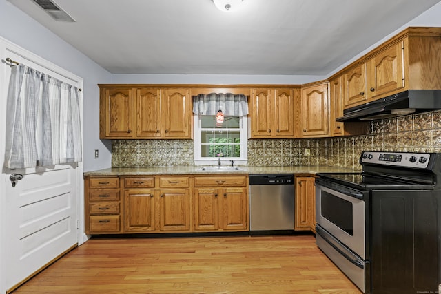 29 Boswell Rd, West Hartford, CT 06107 - kitchen with appliances with stainless steel finishes, under cabinet range hood, and brown cabinets
