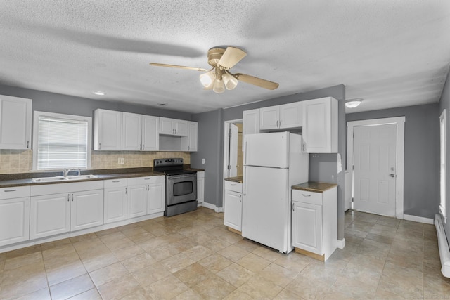 104 Greenwood St, New Britain, CT 06051 - kitchen with freestanding refrigerator, stainless steel electric range oven, dark countertops, backsplash, and a textured ceiling
