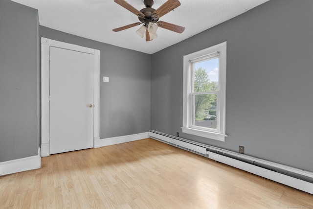 104 Greenwood St, New Britain, CT 06051 - spare room featuring a baseboard radiator, wood finished floors, and a ceiling fan