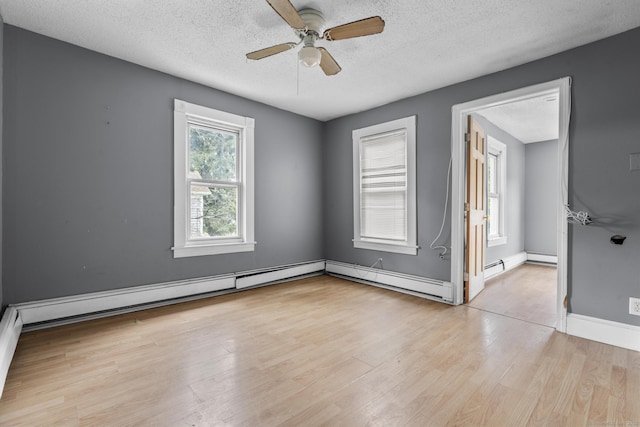 104 Greenwood St, New Britain, CT 06051 - empty room with a textured ceiling, wood finished floors, ceiling fan, and a baseboard radiator