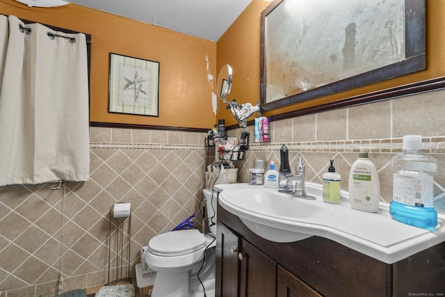 104 Greenwood St, New Britain, CT 06051 - bathroom with tile walls, vanity, and wainscoting