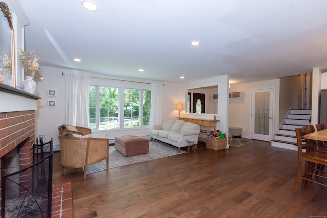 34 Taft St, Killingly, CT 06239 - living area featuring wood finished floors, a brick fireplace, recessed lighting, and stairs