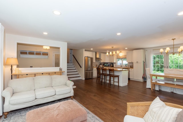 34 Taft St, Killingly, CT 06239 - living room featuring a chandelier, recessed lighting, dark wood-style floors, and stairs