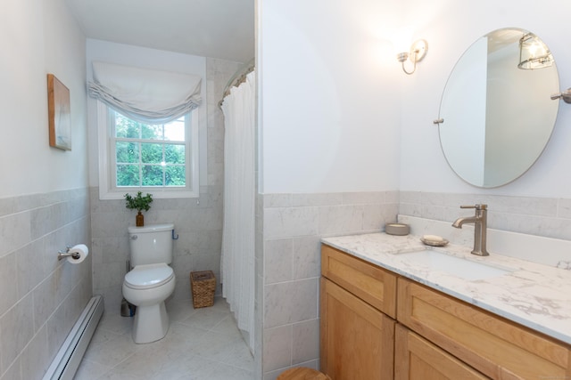 34 Taft St, Killingly, CT 06239 - bathroom with tile walls, a baseboard radiator, vanity, tile patterned floors, and a wainscoted wall