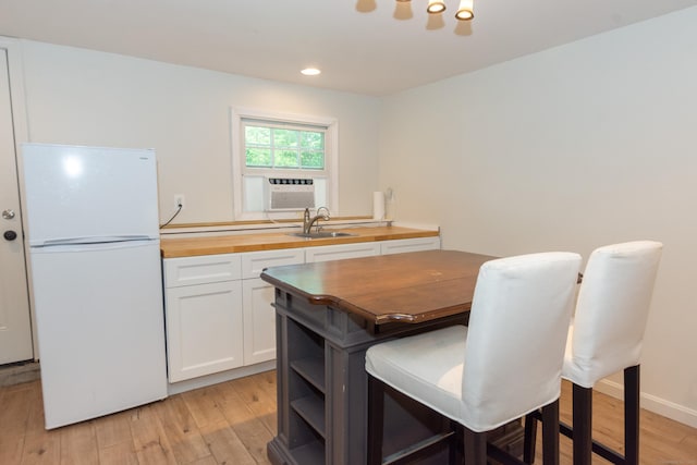 34 Taft St, Killingly, CT 06239 - dining area featuring cooling unit, light wood-style floors, and recessed lighting