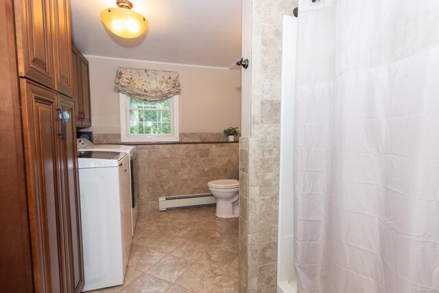 34 Taft St, Killingly, CT 06239 - full bath featuring a baseboard heating unit, tile walls, washer and clothes dryer, vanity, and a shower with curtain