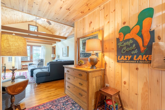 56 Wildwood Rd, East Haddam, CT 06423 - living area with wood finished floors, wood ceiling, lofted ceiling, wooden walls, and a ceiling fan