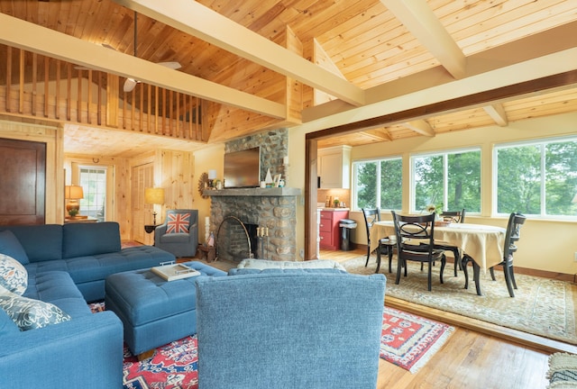 56 Wildwood Rd, East Haddam, CT 06423 - living room featuring light wood-style floors, a stone fireplace, and wooden ceiling