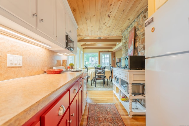 56 Wildwood Rd, East Haddam, CT 06423 - kitchen with freestanding refrigerator, stainless steel microwave, wooden ceiling, range with electric cooktop, and light wood-type flooring