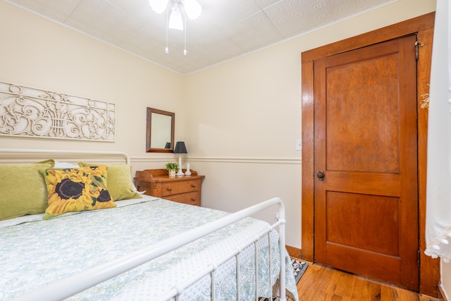 56 Wildwood Rd, East Haddam, CT 06423 - bedroom with light wood finished floors and crown molding