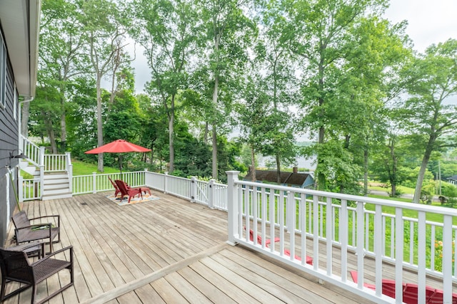 56 Wildwood Rd, East Haddam, CT 06423 - deck featuring view of scattered trees and stairs