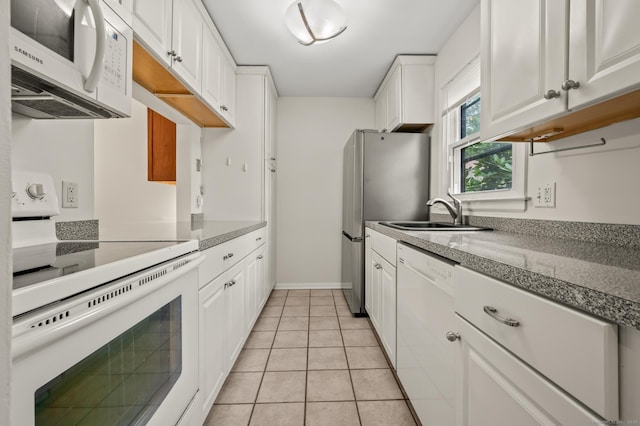 11 Danforth Ln Unit 11, Rocky Hill, CT 06067 - kitchen with white appliances, white cabinetry, and light tile patterned flooring