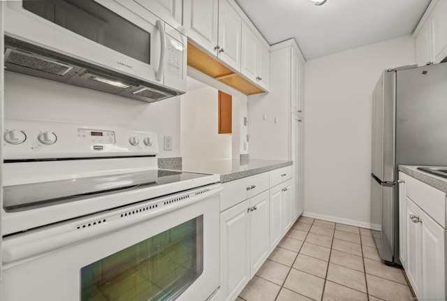 11 Danforth Ln Unit 11, Rocky Hill, CT 06067 - kitchen with white range with electric stovetop, freestanding refrigerator, and white cabinetry
