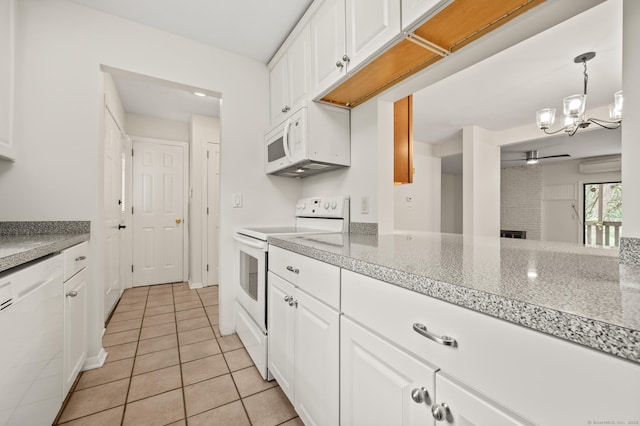11 Danforth Ln Unit 11, Rocky Hill, CT 06067 - kitchen with white appliances, light tile patterned floors, ceiling fan, white cabinets, and a chandelier