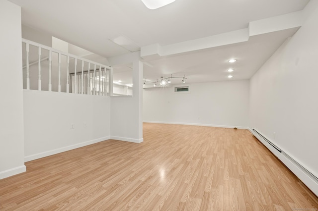 11 Danforth Ln Unit 11, Rocky Hill, CT 06067 - unfurnished room featuring a baseboard heating unit and light wood-style flooring