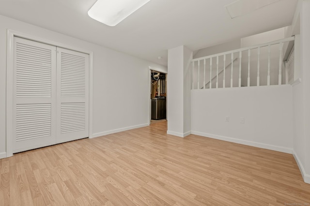 11 Danforth Ln Unit 11, Rocky Hill, CT 06067 - unfurnished bedroom with light wood finished floors and a closet