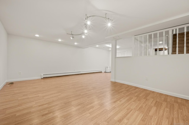 11 Danforth Ln Unit 11, Rocky Hill, CT 06067 - empty room featuring baseboard heating, light wood finished floors, recessed lighting, and track lighting