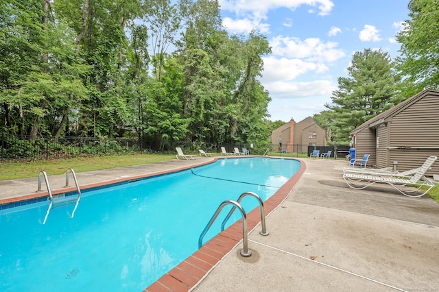11 Danforth Ln Unit 11, Rocky Hill, CT 06067 - view of pool with a patio and view of scattered trees