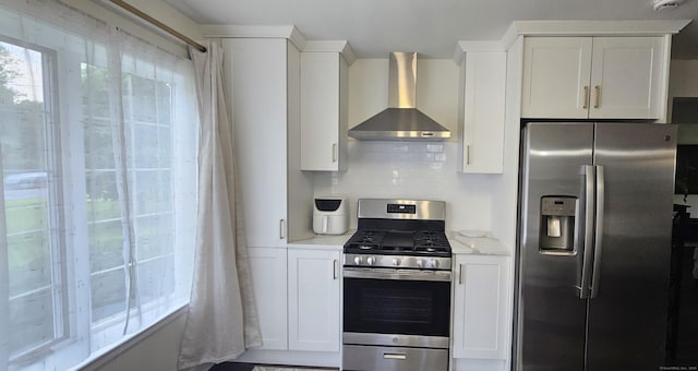 187 Two Rod Hwy, Wethersfield, CT 06109 - kitchen featuring appliances with stainless steel finishes, wall chimney range hood, backsplash, white cabinets, and light stone counters