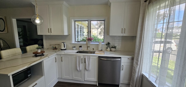 187 Two Rod Hwy, Wethersfield, CT 06109 - kitchen featuring appliances with stainless steel finishes, decorative backsplash, and white cabinets