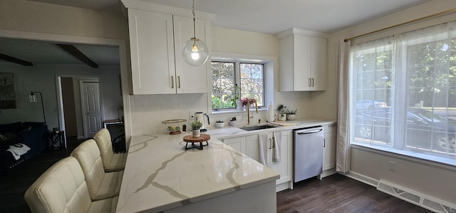 187 Two Rod Hwy, Wethersfield, CT 06109 - kitchen with stainless steel dishwasher, decorative backsplash, white cabinets, light stone counters, and dark wood-type flooring