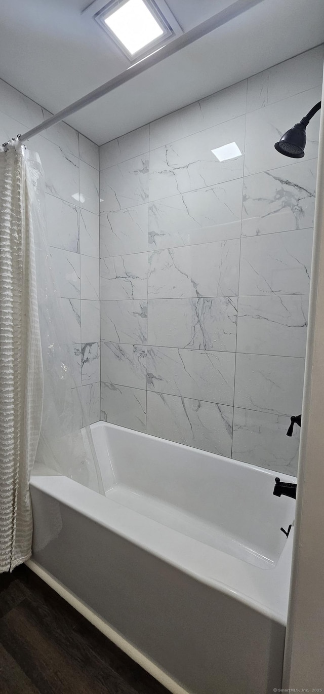 187 Two Rod Hwy, Wethersfield, CT 06109 - full bathroom featuring shower / bath combo with shower curtain and wood finished floors