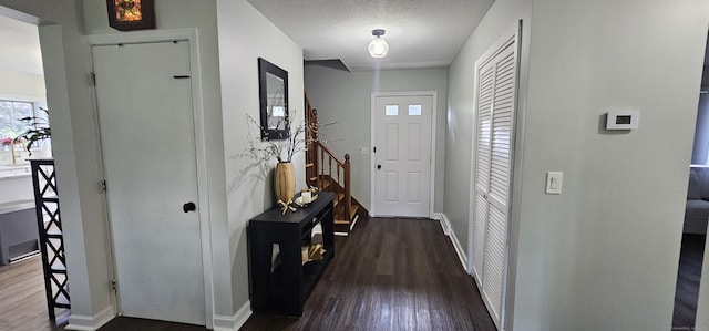 187 Two Rod Hwy, Wethersfield, CT 06109 - entryway with dark wood-style flooring and a textured ceiling