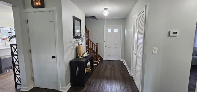 187 Two Rod Hwy, Wethersfield, CT 06109 - entryway with dark wood-style flooring and a textured ceiling