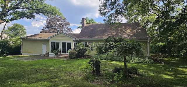 187 Two Rod Hwy, Wethersfield, CT 06109 - back of property featuring entry steps, a chimney, and a lawn