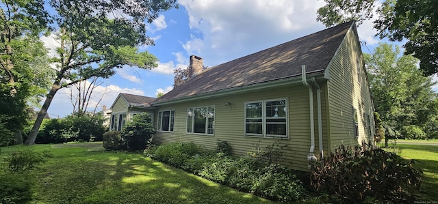 187 Two Rod Hwy, Wethersfield, CT 06109 - view of side of home with a yard and a chimney