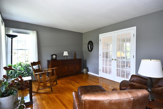 32 Sable Dr, Ledyard, CT 06339 - living area with wood finished floors and french doors