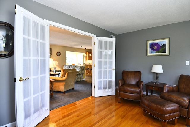 32 Sable Dr, Ledyard, CT 06339 - living area featuring wood finished floors and french doors