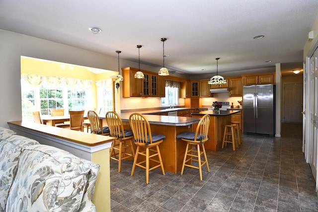 32 Sable Dr, Ledyard, CT 06339 - kitchen with stainless steel appliances, brown cabinets, healthy amount of natural light, and recessed lighting