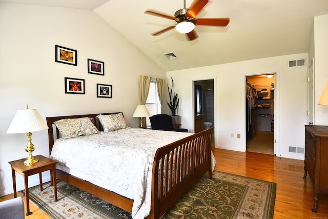 32 Sable Dr, Ledyard, CT 06339 - bedroom featuring a spacious closet, wood finished floors, vaulted ceiling, a closet, and ensuite bathroom