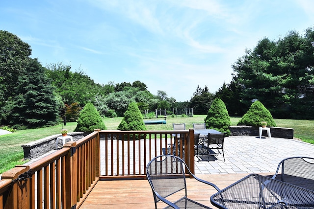 32 Sable Dr, Ledyard, CT 06339 - wooden deck with a patio, a lawn, and view of wooded area