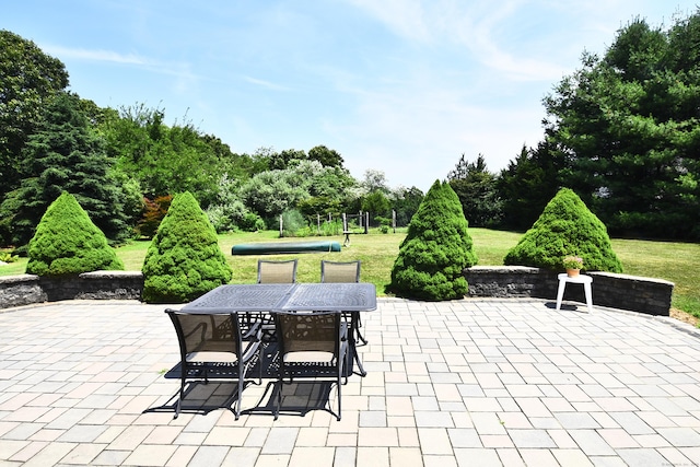 32 Sable Dr, Ledyard, CT 06339 - view of patio / terrace with outdoor dining space and view of scattered trees