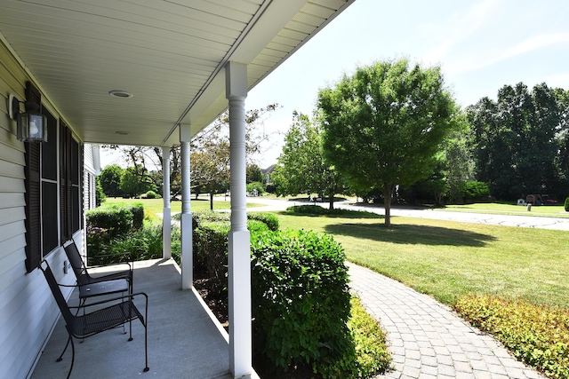 32 Sable Dr, Ledyard, CT 06339 - covered porch featuring a lawn