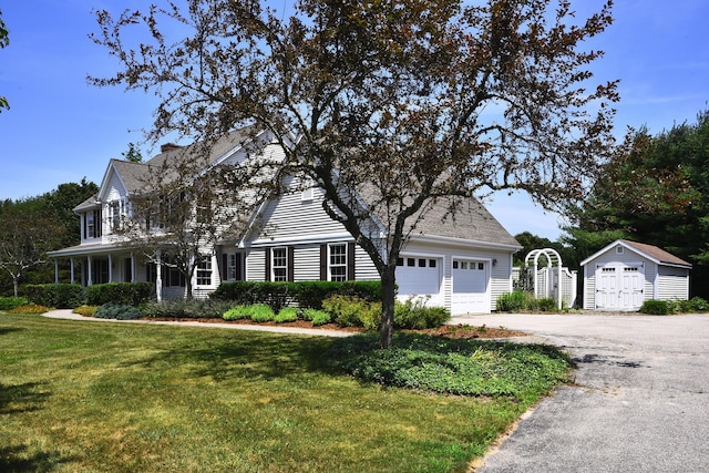 32 Sable Dr, Ledyard, CT 06339 - view of front facade featuring a front yard, a storage shed, and asphalt driveway